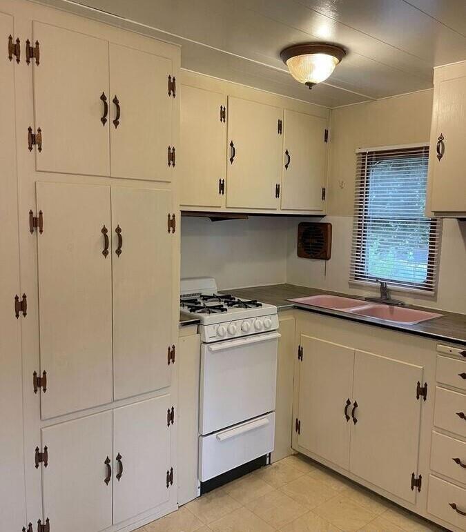 17653 Vierra Canyon Road Salinas, CA 93907 - Photo 12 of 100 a kitchen with cabinets appliances and a window