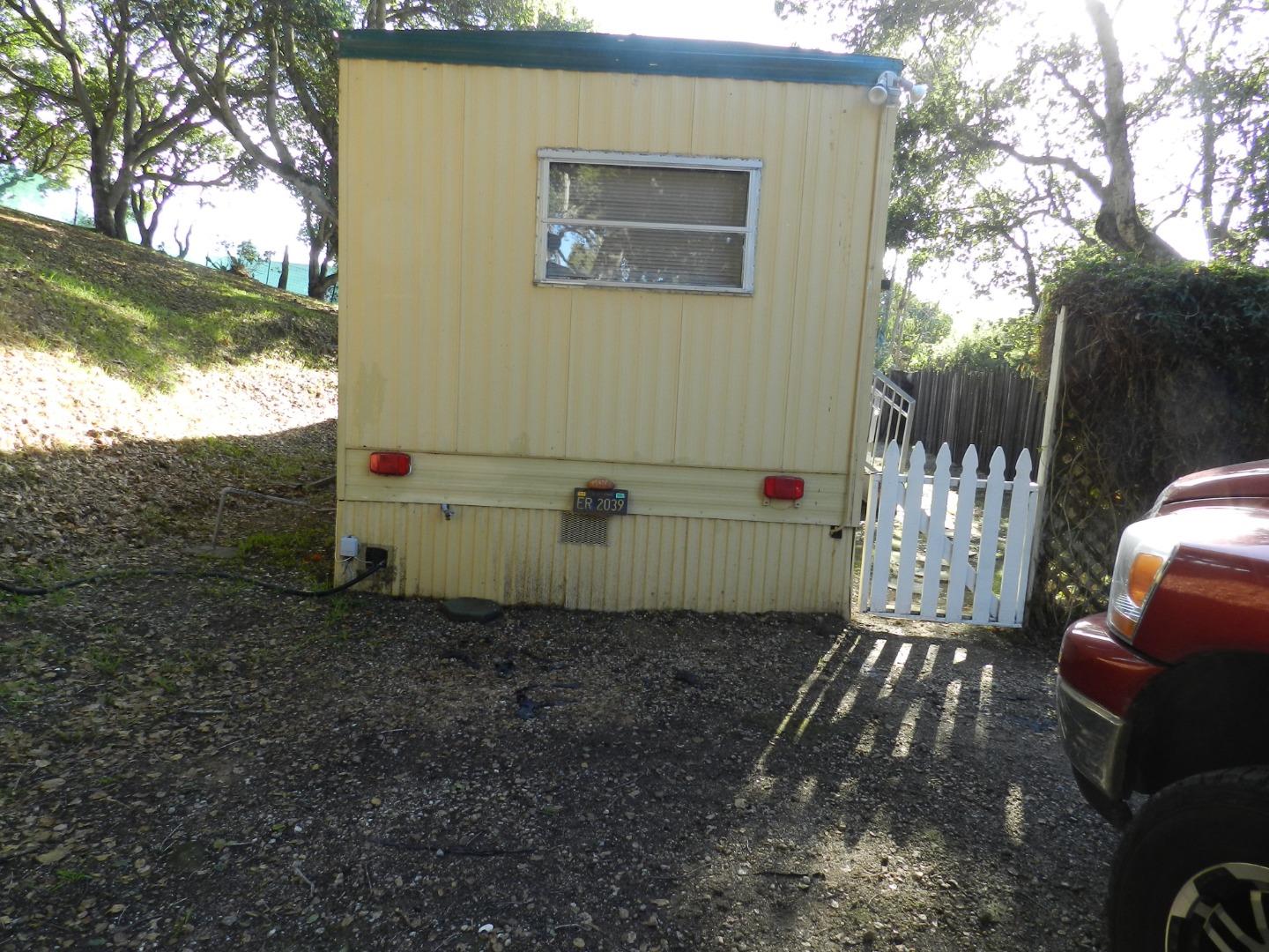 17653 Vierra Canyon Road Salinas, CA 93907 - Photo 2 of 100 a view of a yard with wooden fence and a bench
