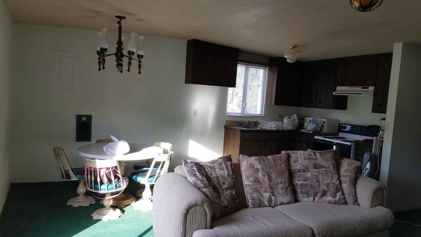 17653 Vierra Canyon Road Salinas, CA 93907 - Photo 35 of 100 a living room with furniture and a flat screen tv