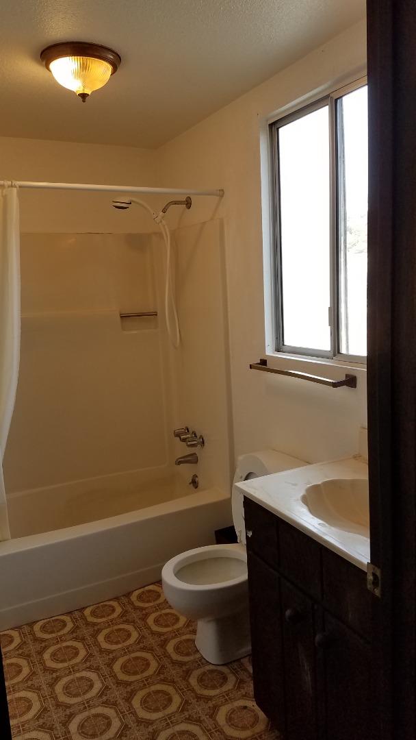 17653 Vierra Canyon Road Salinas, CA 93907 - Photo 37 of 100 a bathroom with a sink a toilet and shower