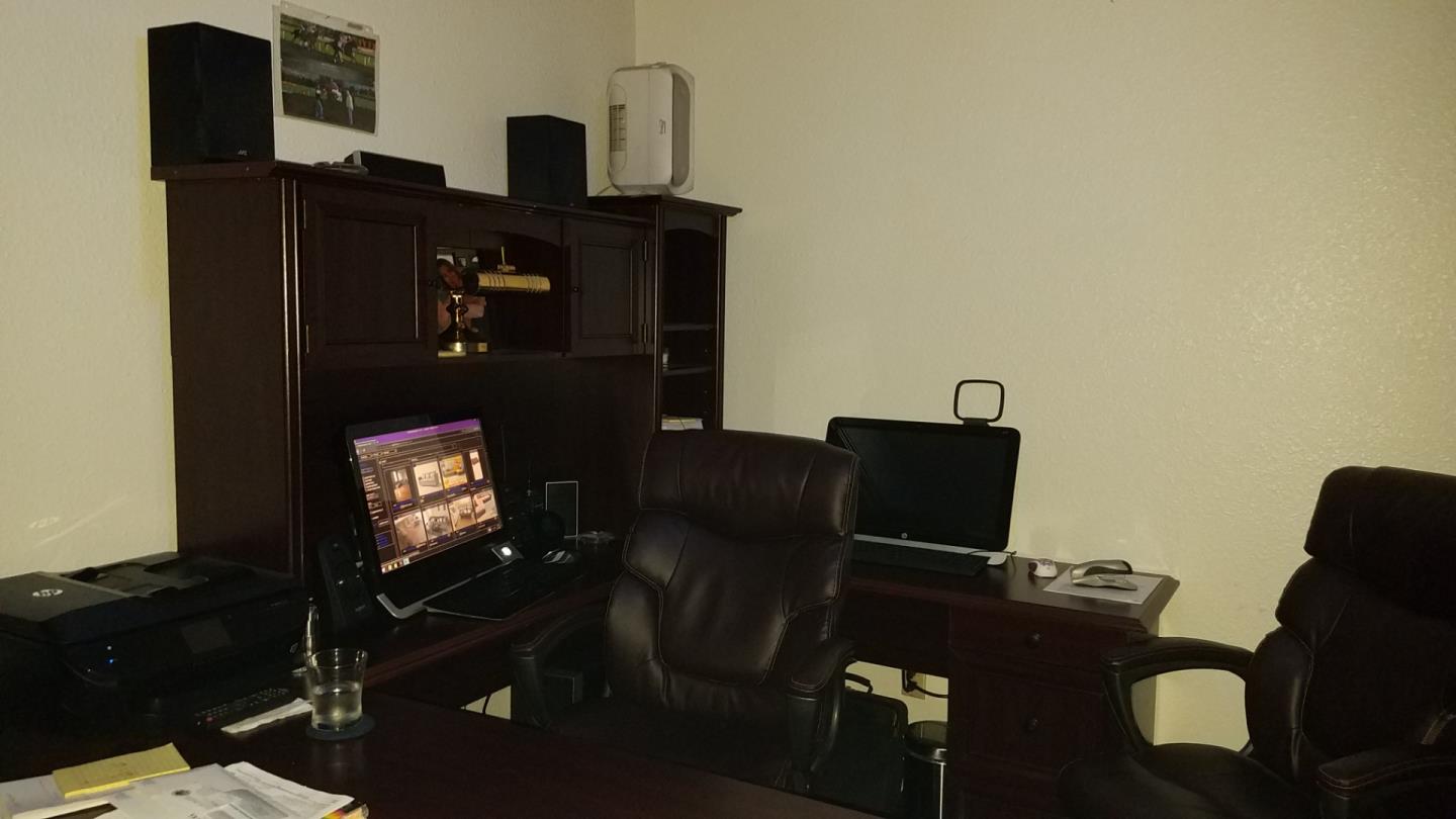 17653 Vierra Canyon Road Salinas, CA 93907 - Photo 40 of 100 a living room with furniture mirror and a flat screen tv