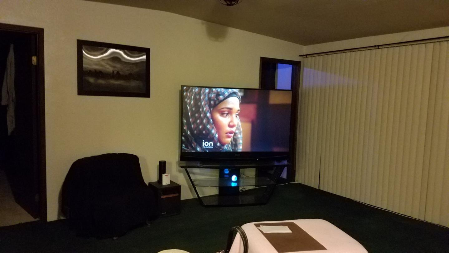 17653 Vierra Canyon Road Salinas, CA 93907 - Photo 43 of 100 a living room with furniture and a flat screen tv