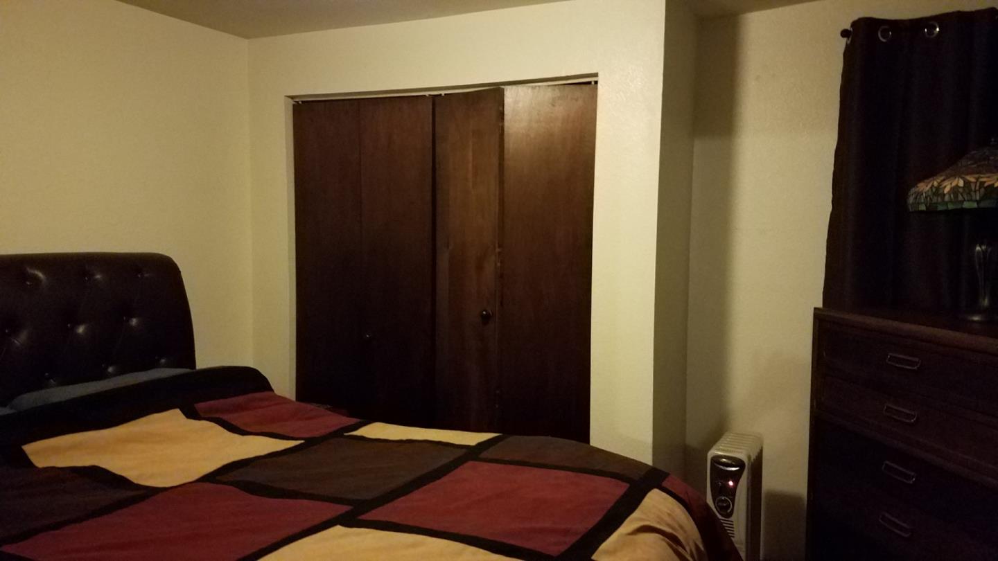 17653 Vierra Canyon Road Salinas, CA 93907 - Photo 46 of 100 a bedroom with a bed and a mirror