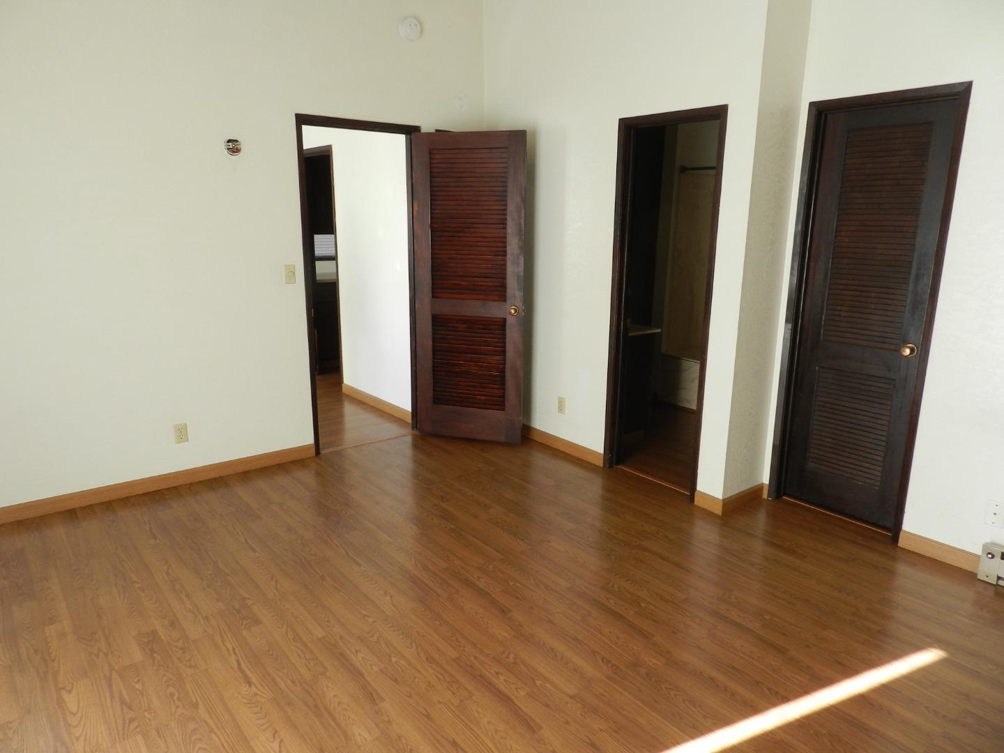 17653 Vierra Canyon Road Salinas, CA 93907 - Photo 90 of 100 an empty room with wooden floor and closet