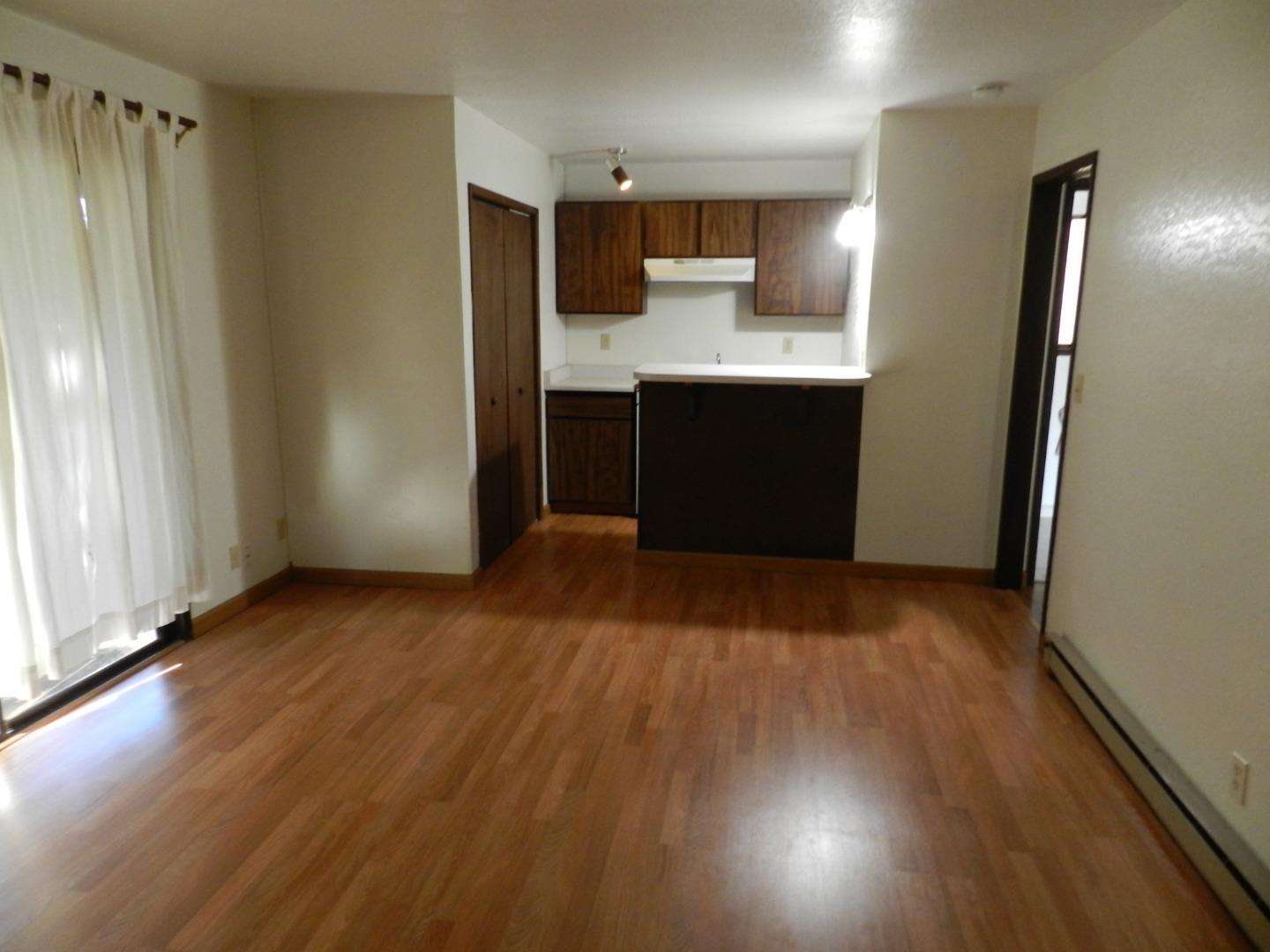 17653 Vierra Canyon Road Salinas, CA 93907 - Photo 96 of 100 a view of a kitchen with wooden floor electronic appliances and a window