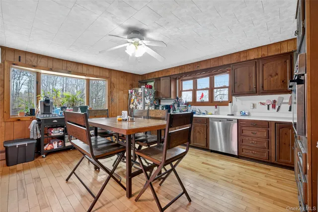 a kitchen with stainless steel appliances granite countertop a sink and cabinets