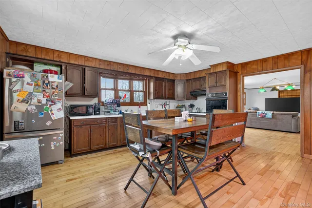 a view of a dining room with furniture and a livingroom