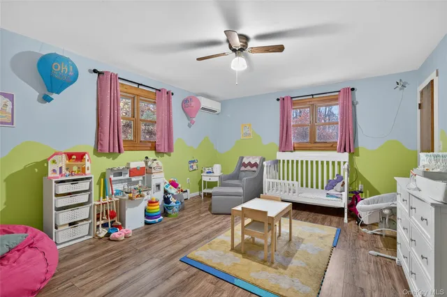 a bedroom with a bed and dresser