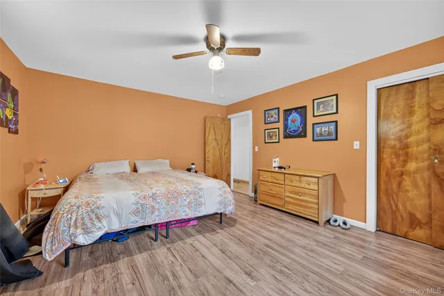 a view of a gallery with wooden floor