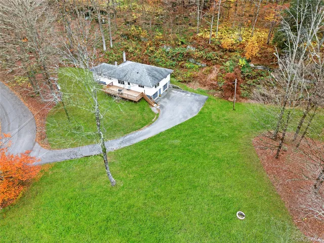 a backyard of a house with lots of green space