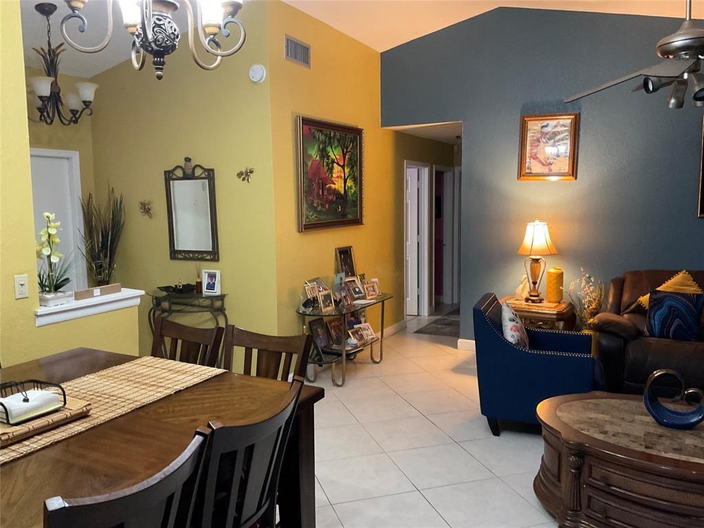 4770 Northwest 85th Avenue Lauderhill, FL 33351 - Photo 11 of 44 a living room with furniture and wooden floor