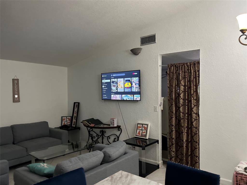4770 Northwest 85th Avenue Lauderhill, FL 33351 - Photo 26 of 44 a living room with furniture a rug and a window