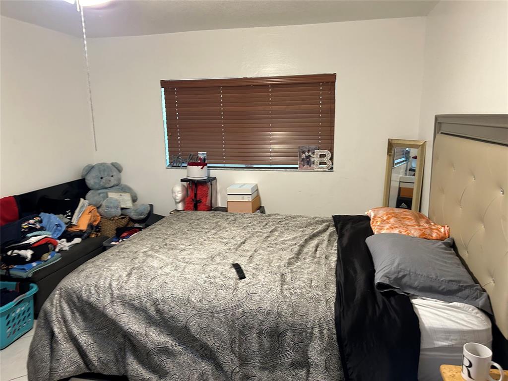 4770 Northwest 85th Avenue Lauderhill, FL 33351 - Photo 28 of 44 a bedroom with a bed and a dresser