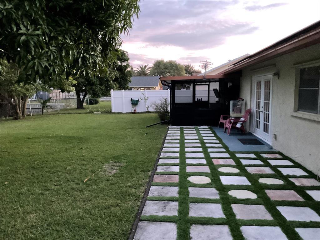 4770 Northwest 85th Avenue Lauderhill, FL 33351 - Photo 41 of 44 a front view of a house with a yard
