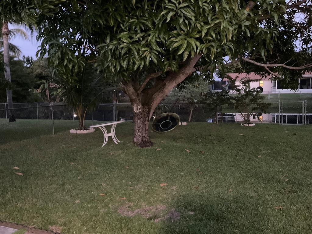 4770 Northwest 85th Avenue Lauderhill, FL 33351 - Photo 44 of 44 a backyard of a house with lots of green space