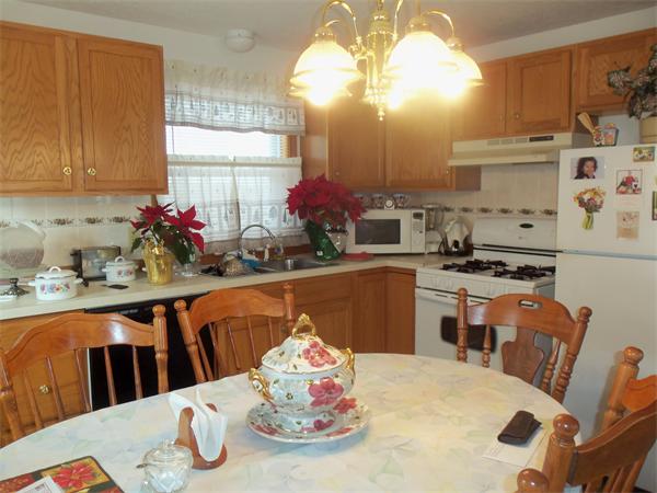 45 Beach Fall River Ma Fall River, MA 02721 - Photo 4 of 18 a kitchen with stainless steel appliances kitchen island granite countertop a table and chairs