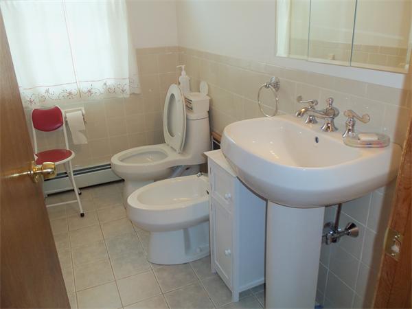 45 Beach Fall River Ma Fall River, MA 02721 - Photo 6 of 18 a bathroom with a sink mirror and toilet