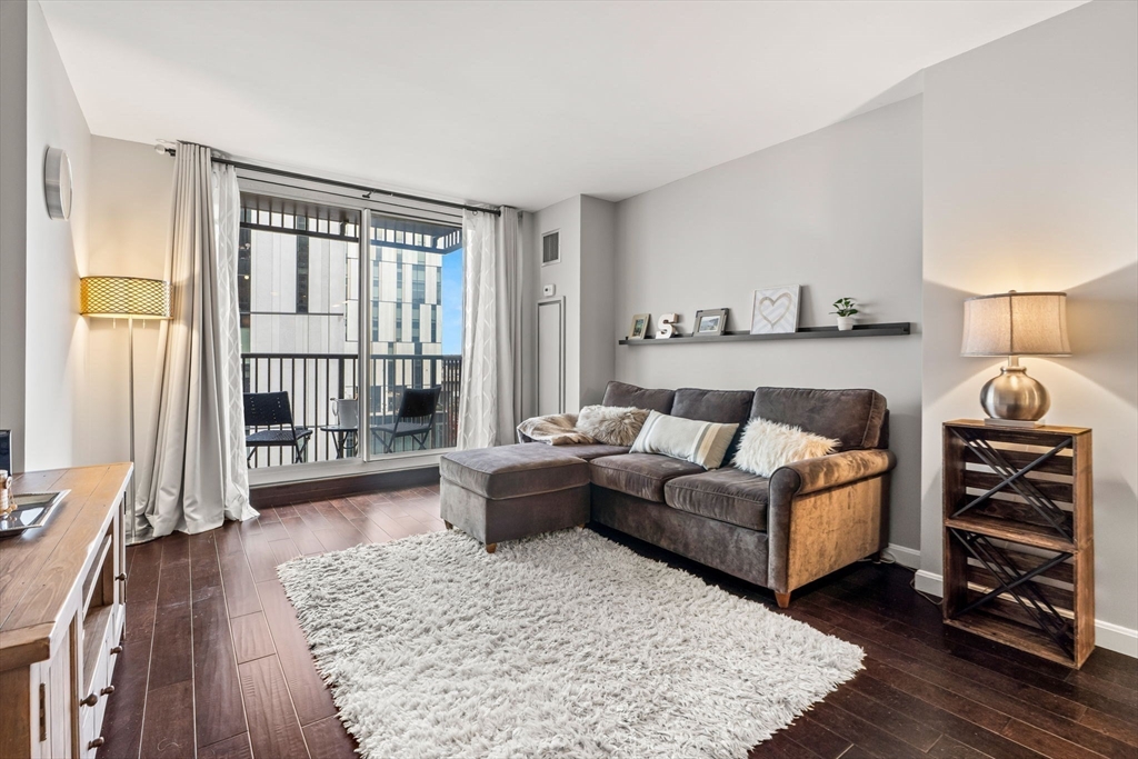 10 Museum Way, Unit 828 Cambridge, MA 02141 - Photo 12 of 36 a living room with furniture and a window