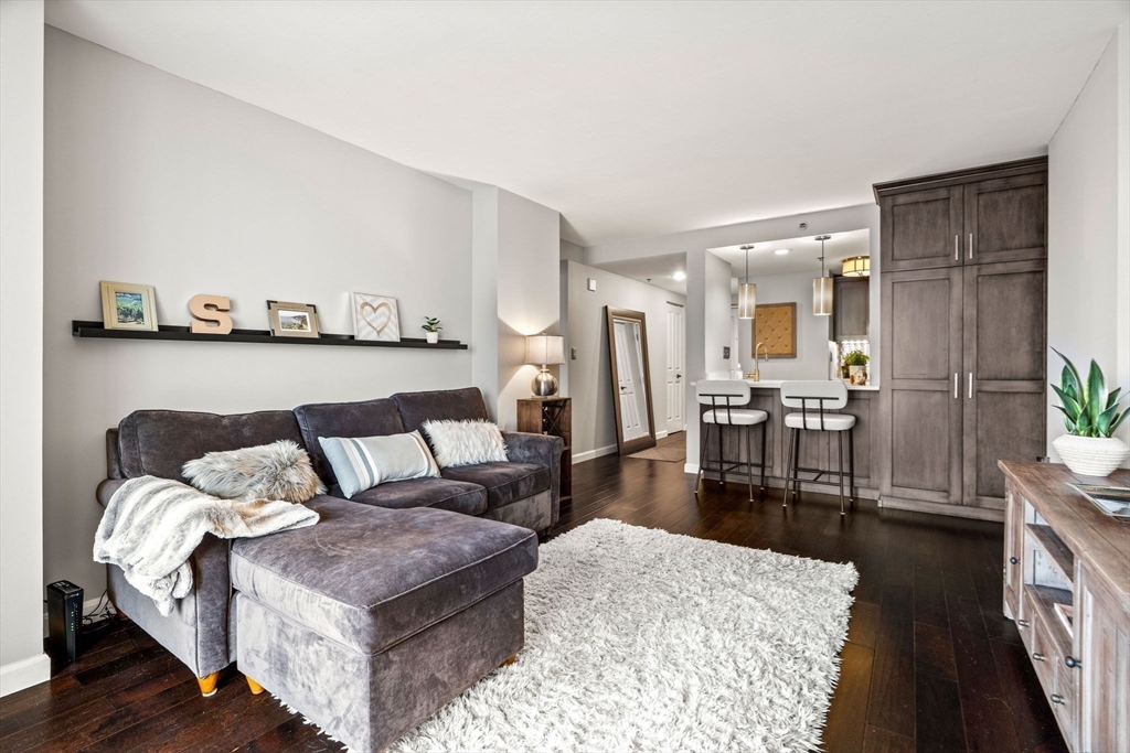 10 Museum Way, Unit 828 Cambridge, MA 02141 - Photo 13 of 36 a living room with furniture and wooden floor