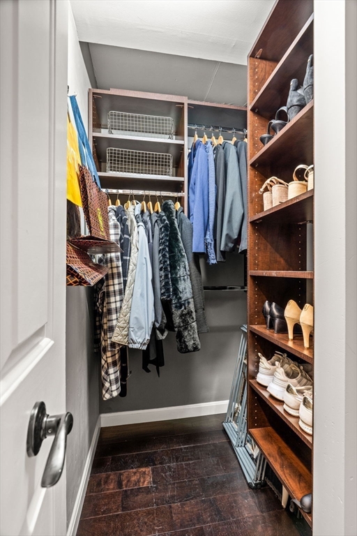 10 Museum Way, Unit 828 Cambridge, MA 02141 - Photo 23 of 36 a view of walk in closet with clothes and shoes