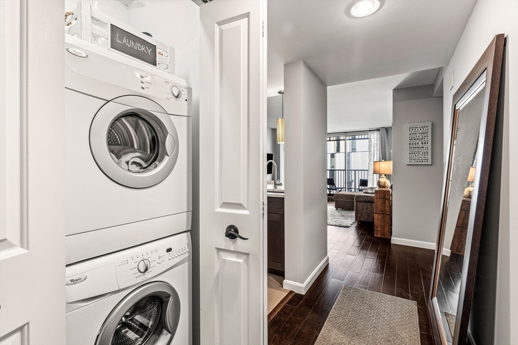 10 Museum Way, Unit 828 Cambridge, MA 02141 - Photo 24 of 36 a view of a hallway with washer and dryer