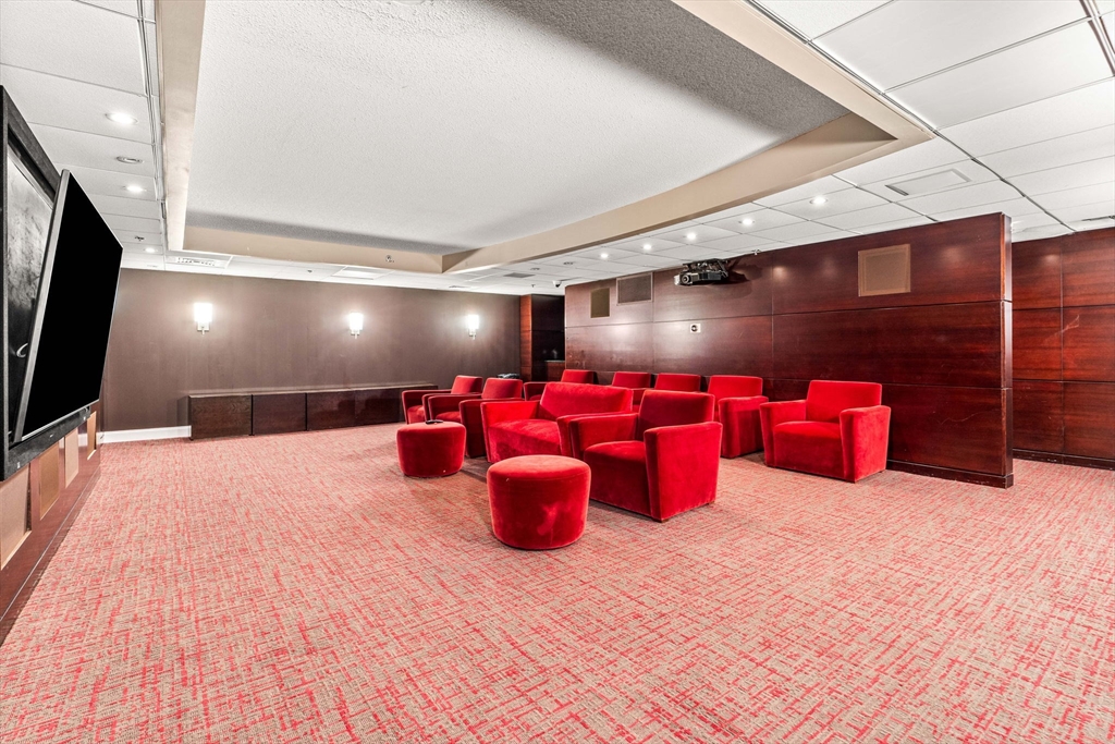 10 Museum Way, Unit 828 Cambridge, MA 02141 - Photo 31 of 36 a room with gym equipment and wooden floors