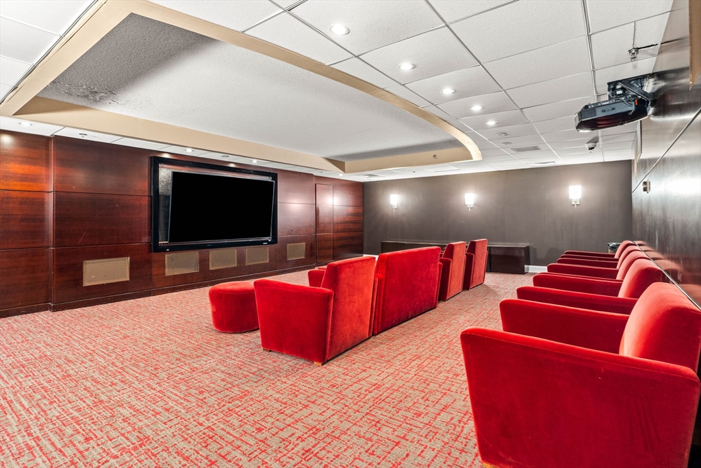 10 Museum Way, Unit 828 Cambridge, MA 02141 - Photo 32 of 36 a living room with furniture and a flat screen tv