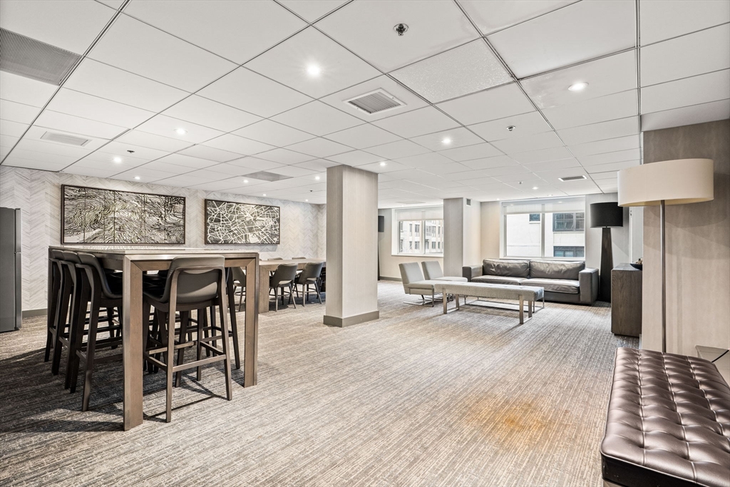 10 Museum Way, Unit 828 Cambridge, MA 02141 - Photo 33 of 36 a view of a dining room with furniture window and wooden floor