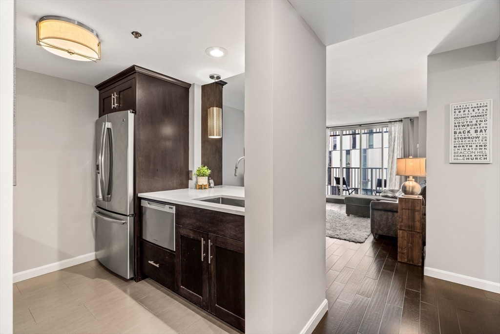 10 Museum Way, Unit 828 Cambridge, MA 02141 - Photo 8 of 36 a kitchen with stainless steel appliances granite countertop a refrigerator and a stove top oven