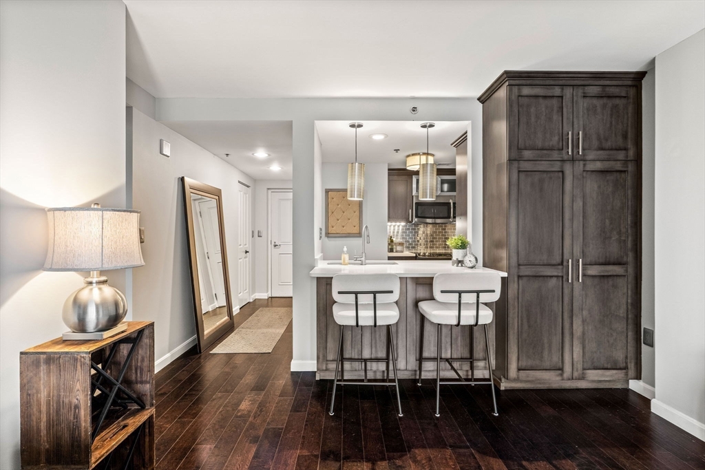10 Museum Way, Unit 828 Cambridge, MA 02141 - Photo 9 of 36 a dining room with furniture and wooden floor
