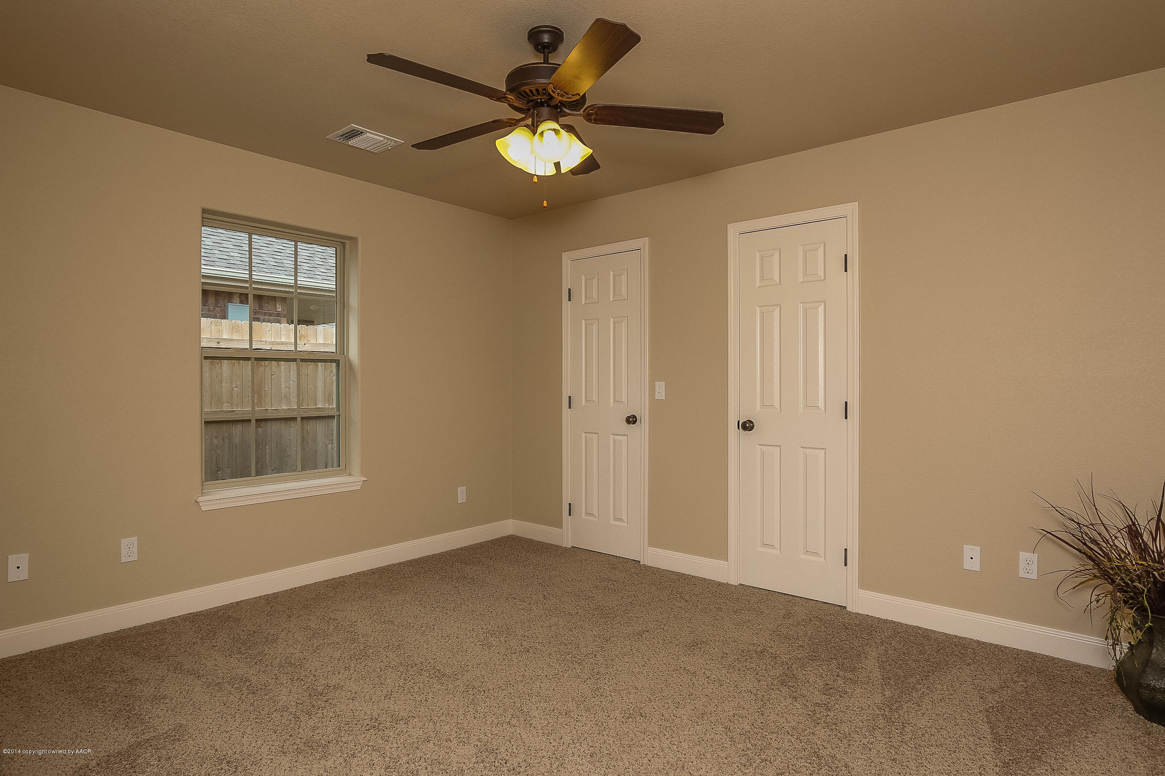 3906 Arden Road Amarillo, TX 79118 - Photo 16 of 22 a view of an empty room with a window