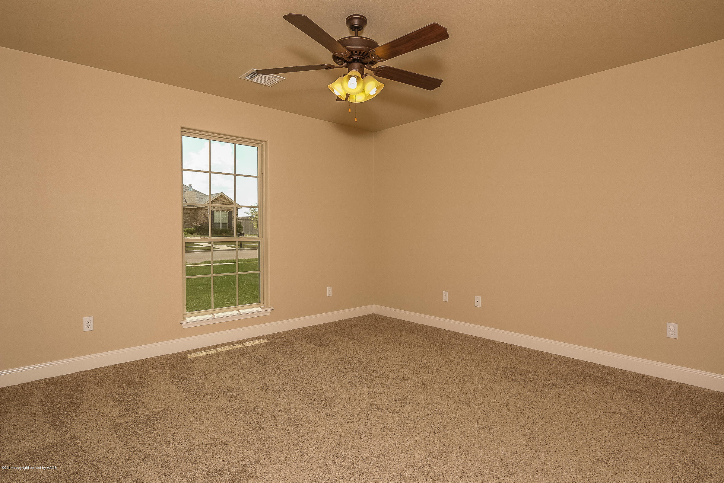 3906 Arden Road Amarillo, TX 79118 - Photo 18 of 22 an empty room with windows and fan