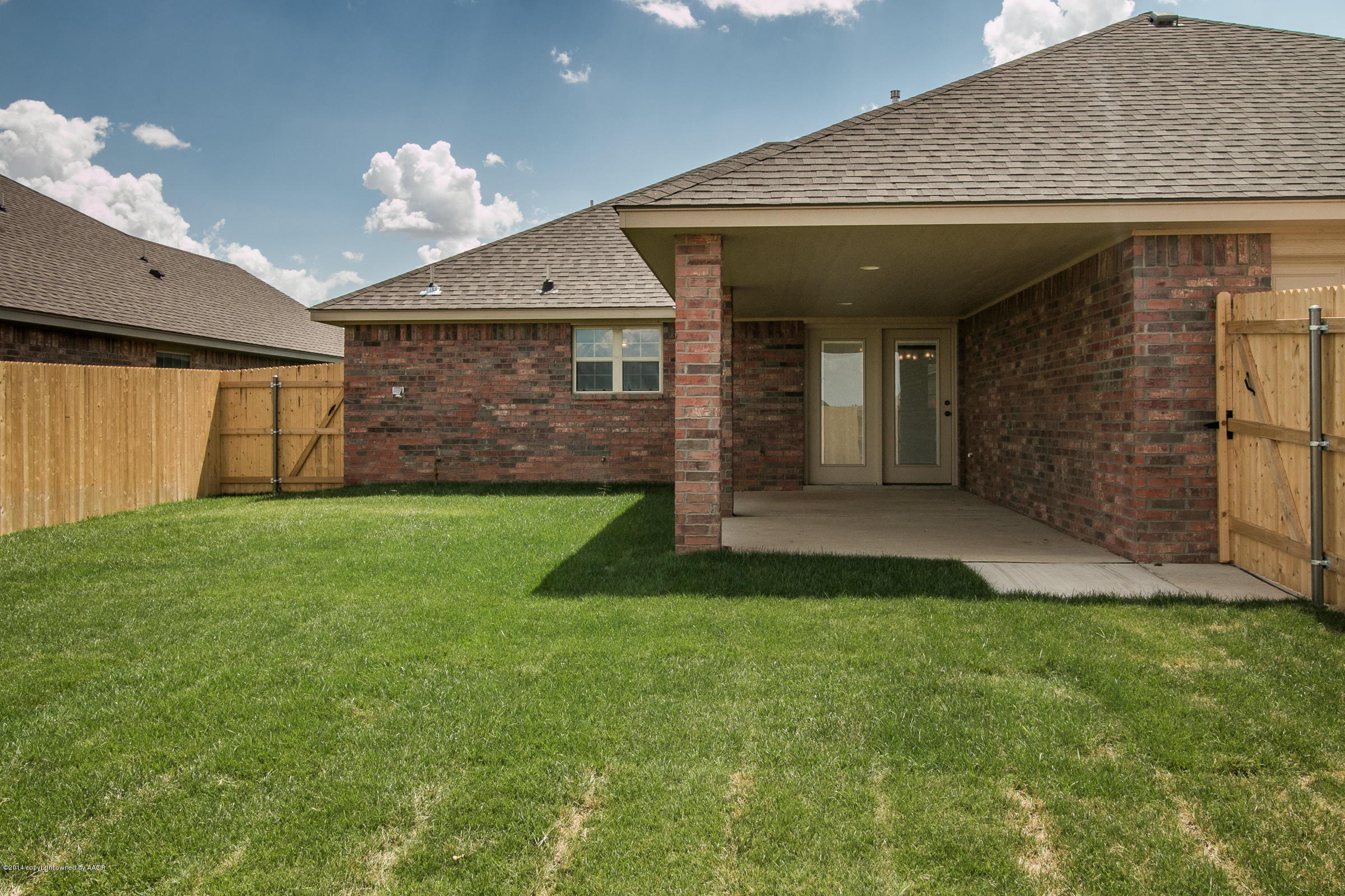 3906 Arden Road Amarillo, TX 79118 - Photo 21 of 22 a front view of a house with a yard and garage