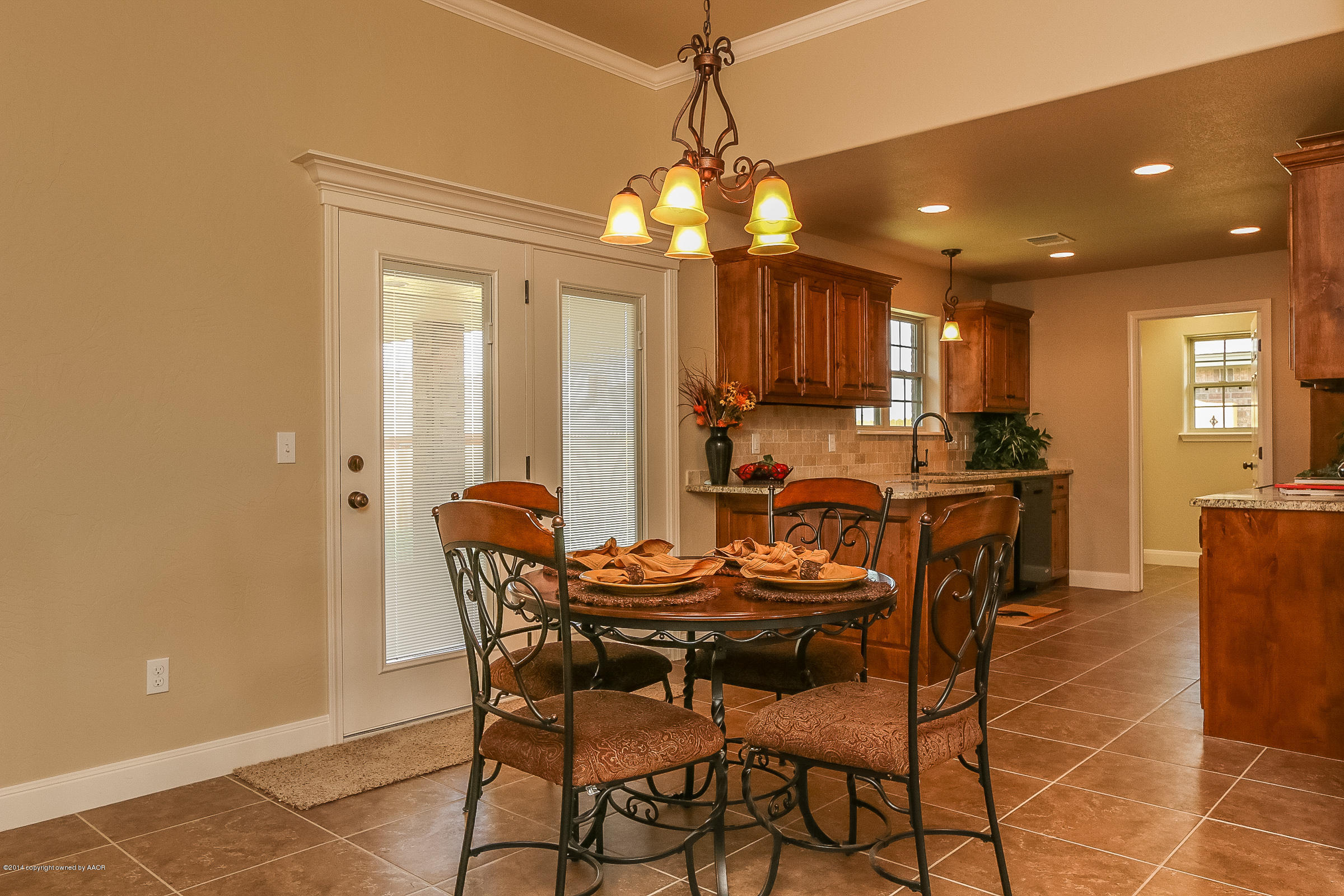 3906 Arden Road Amarillo, TX 79118 - Photo 6 of 22 a view of a dining room with furniture and chandelier