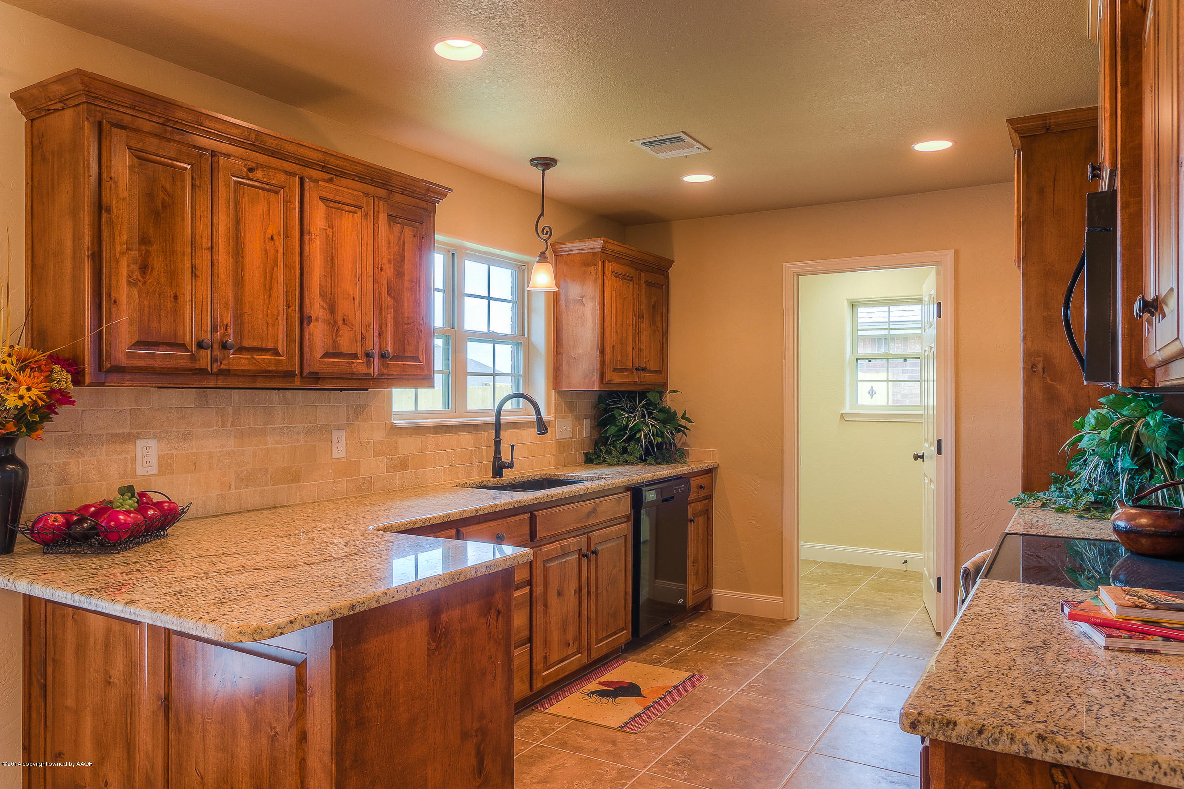 3906 Arden Road Amarillo, TX 79118 - Photo 7 of 22 a kitchen with stainless steel appliances granite countertop a sink stove and cabinets