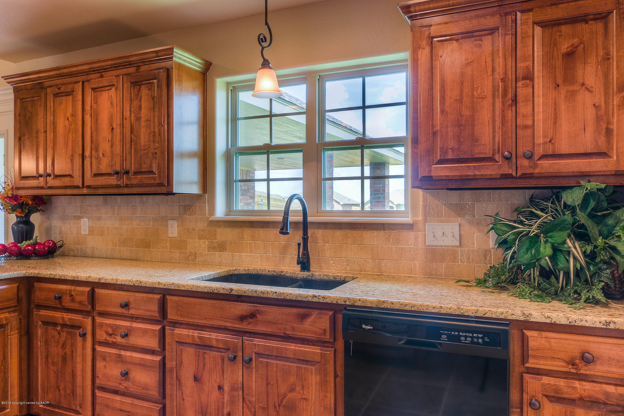3906 Arden Road Amarillo, TX 79118 - Photo 9 of 22 a kitchen with granite countertop a sink and a window