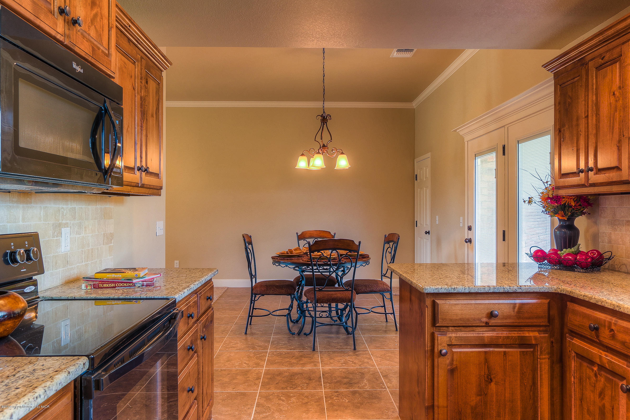 3906 Arden Road Amarillo, TX 79118 - Photo 10 of 22 a kitchen with stainless steel appliances granite countertop a sink a stove and a microwave