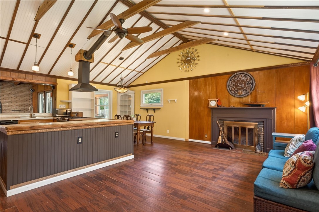 115 Crescent Road Perinton, NY 14450 - Photo 12 of 31 Cathedral Ceilings & Wood-burning fireplace greet