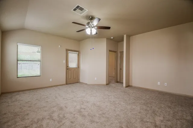 a view of a livingroom with a kitchen