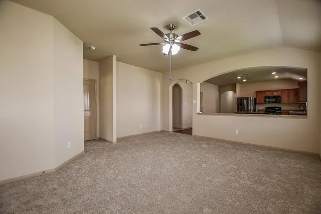 a view of an empty room with a window