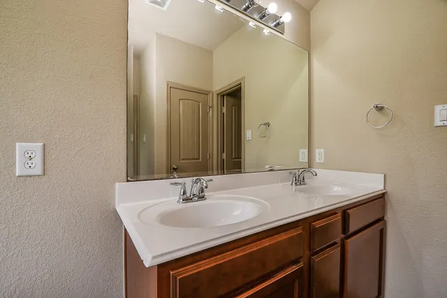 a white bath tub sitting next to a shower