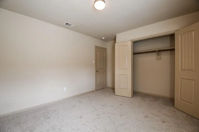 a utility room with cabinets washer and dryer