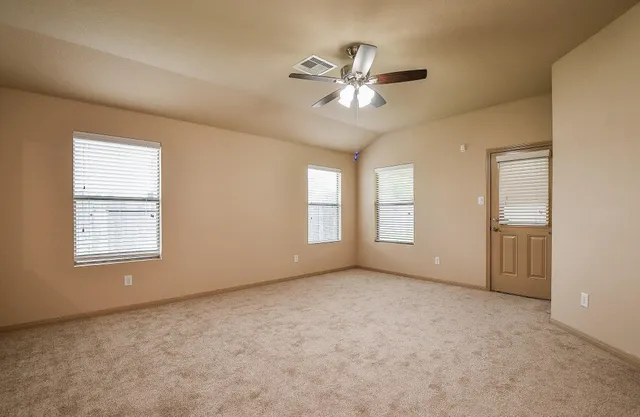 a view of an empty room with a window