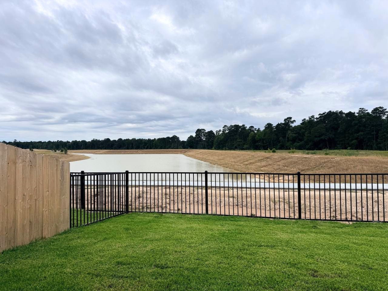 16246 Parish Pointe Court Conroe, TX 77302 - Photo 31 of 32 a view of a yard with a lake view