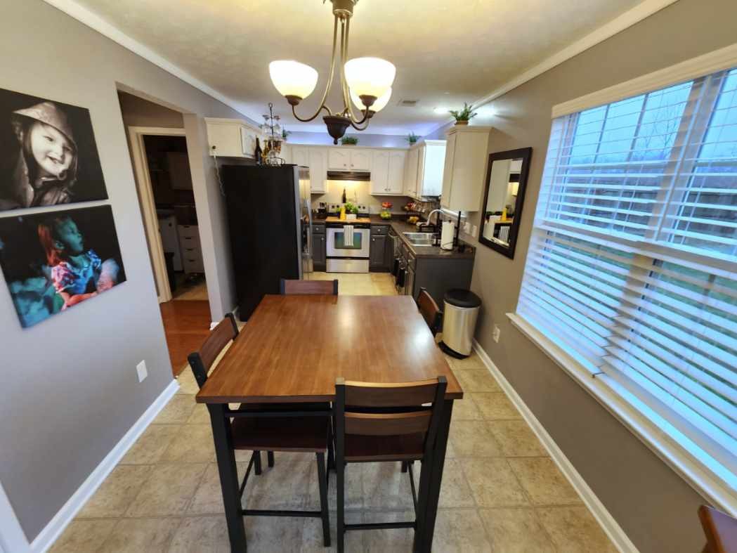 1049 Woodall Road Lebanon, TN 37090 - Photo 16 of 41 a view of a dining room with furniture and wooden floor