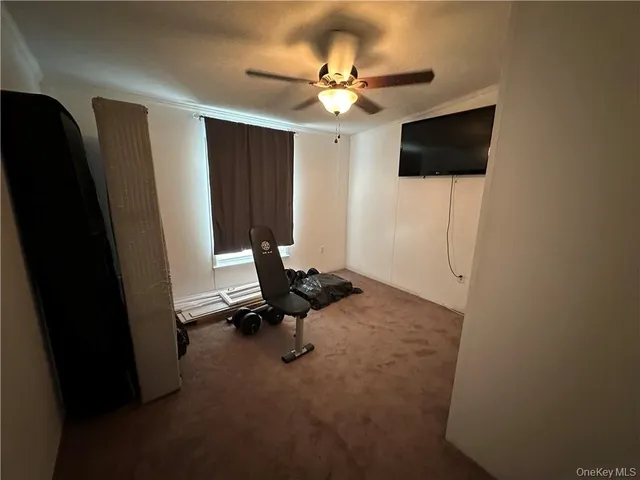 a view of a livingroom with a flat screen tv