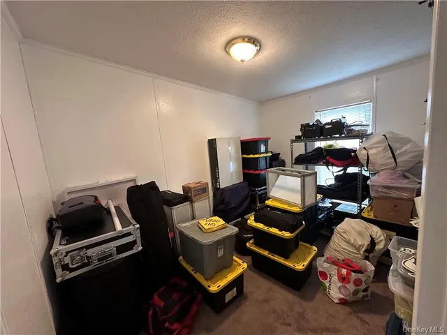 a room with furniture and gym equipment