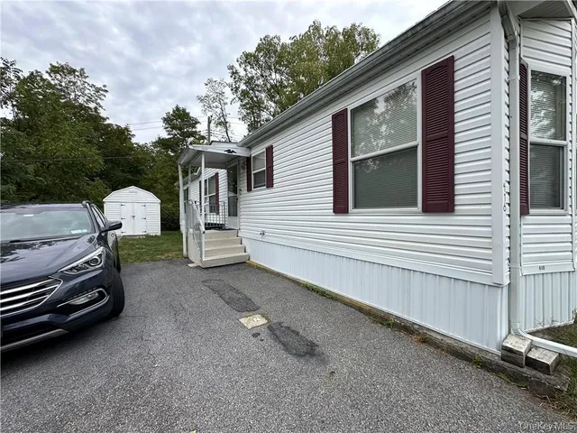a view of a car in front of a house
