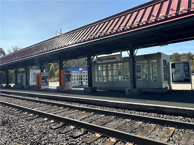 a black car in front of a house