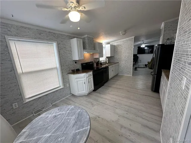 a view of a kitchen with a sink cabinets and window